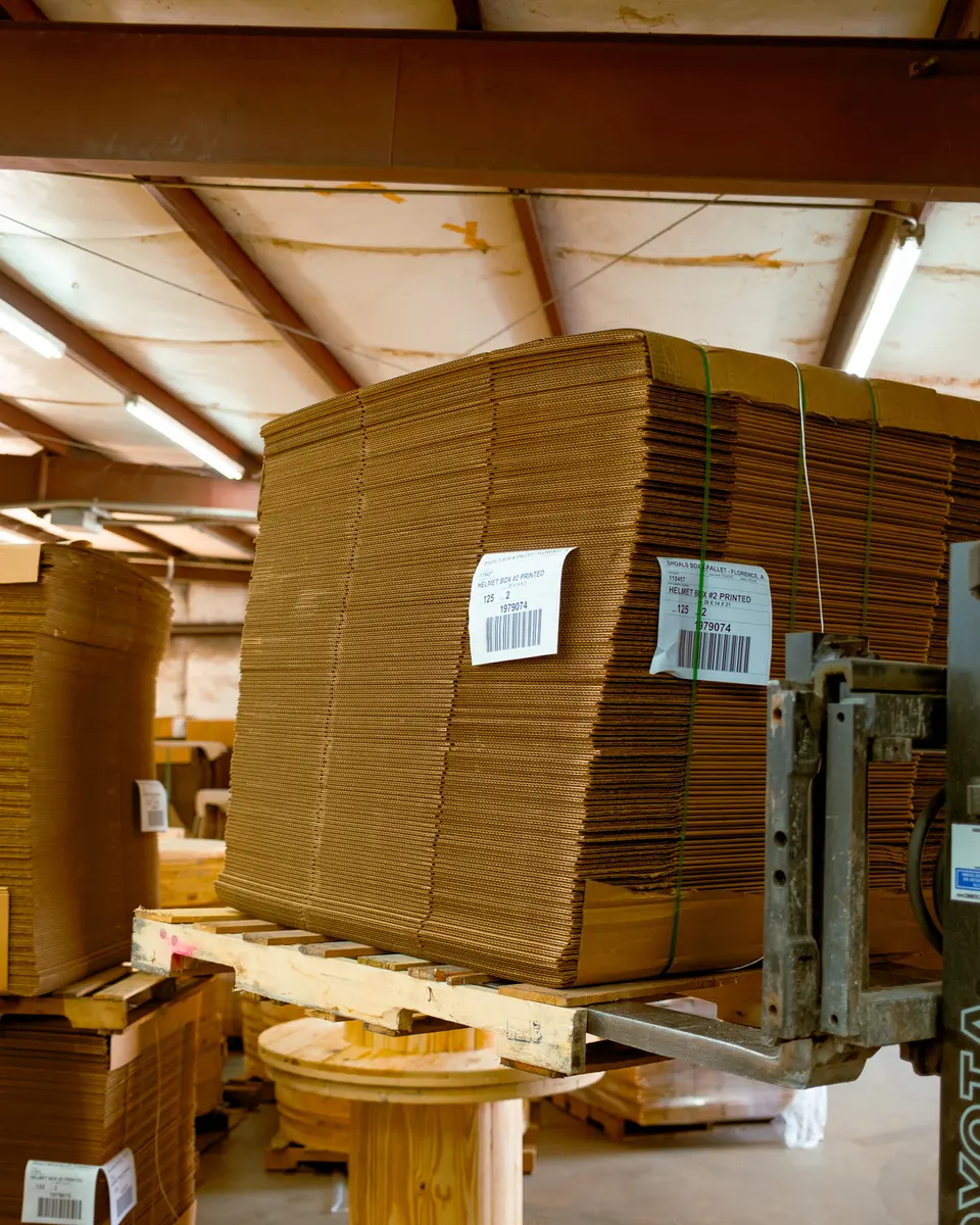 Bundles of corrugated stock staged for die-cutting